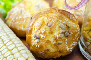 Delicious golden colored corn bread with sesame on a table